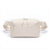 Zeeksack Crossbody Organizer i Sand White med ljusbeige axelrem och framficka.
