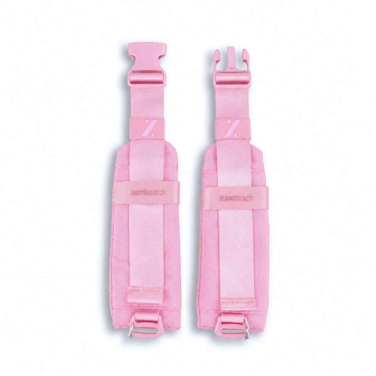 Zeeksack midjebälte i Blossom Pink med rosa vadderade sidodelar, remmar och öppet spänne.